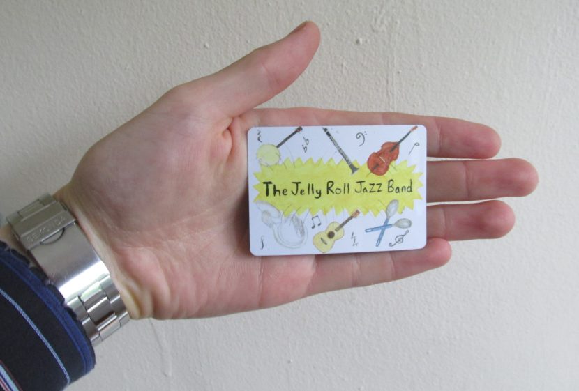 The Jelly Roll Jazz Band fridge magnet, with hand.